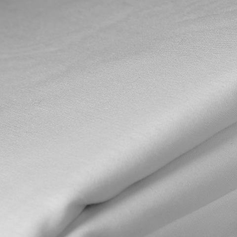 White sheet folded to show the side stitching